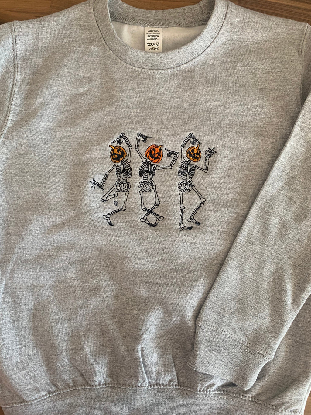 Embroidered Halloween Sweatshirt: Dancing Skeletons Jumper